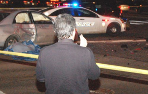 priest praying at accident scene